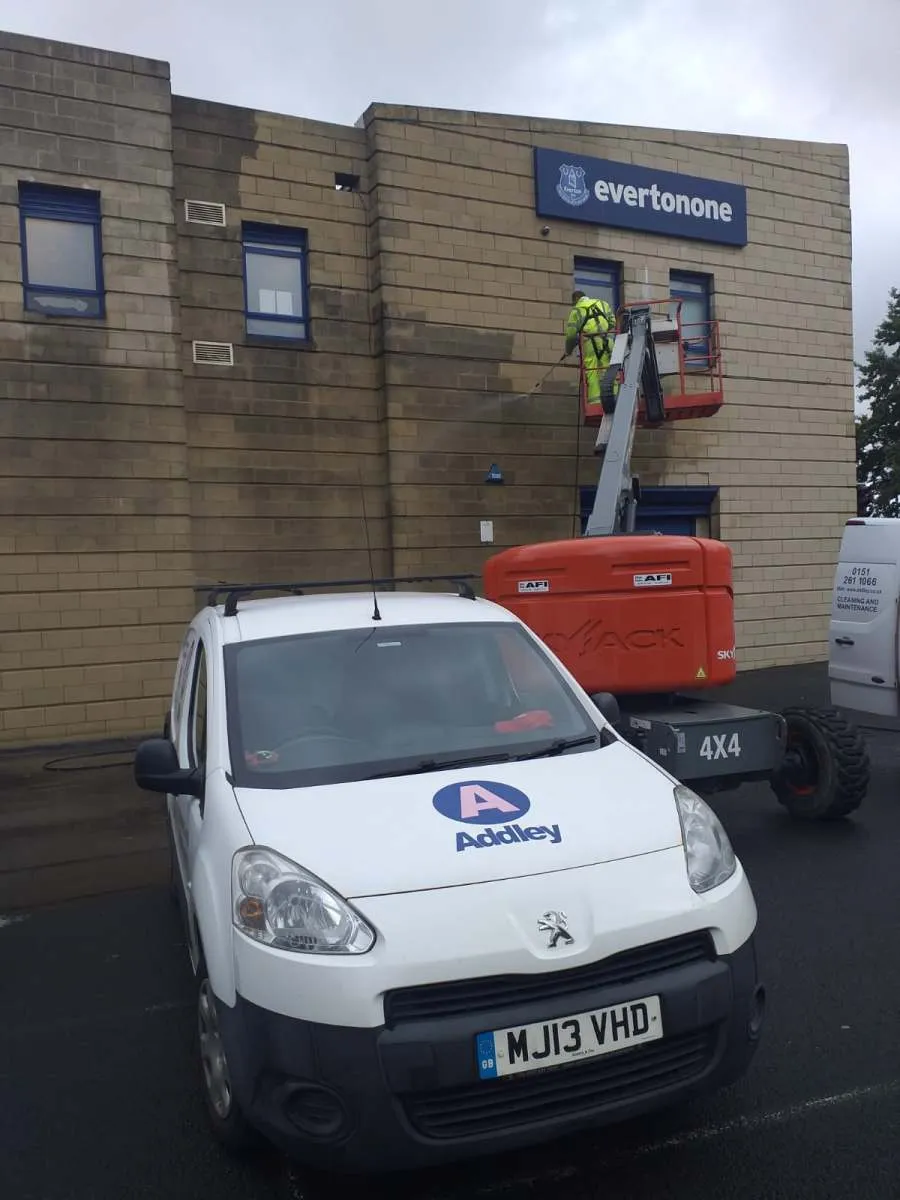 Addley branded van and cherry picker during high level cleaning in Liverpool, John Addley Ltd